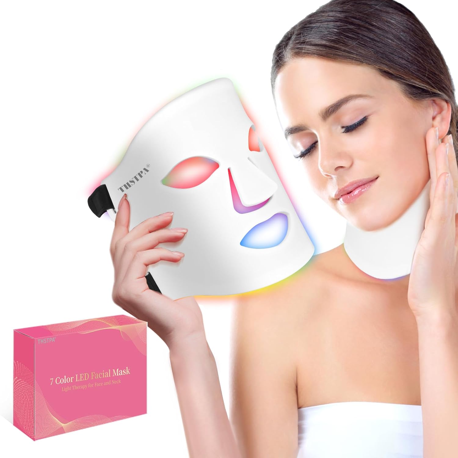 Woman using a 7-color LED facial mask with a pink box in the background