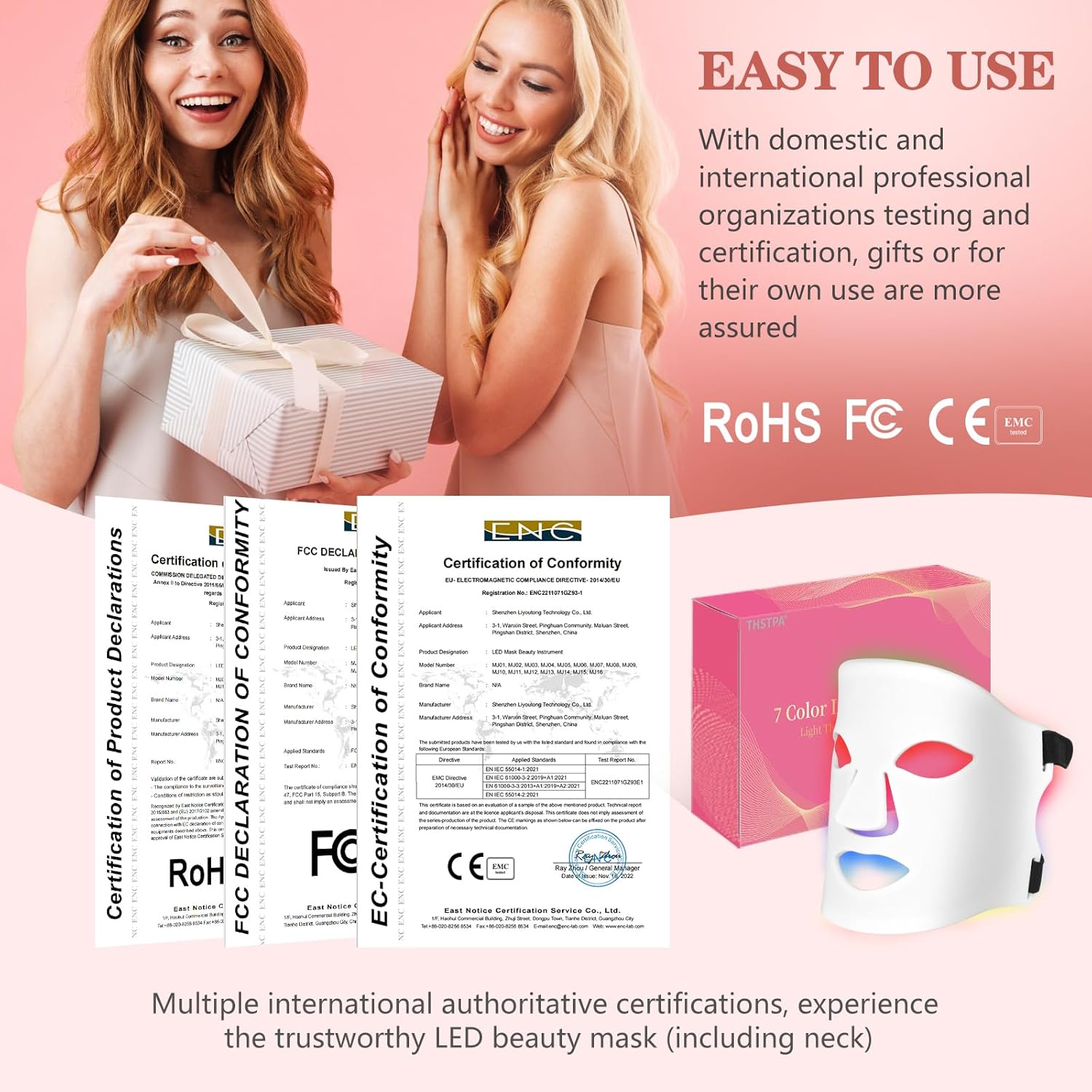 LED beauty mask with certifications and two women holding a gift box on a pink background