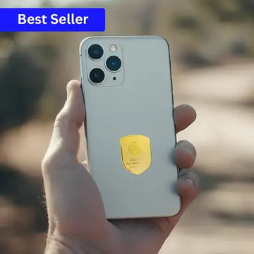 Hand holding a smartphone with a gold emblem, labeled 'Best Seller' on a blurred natural background