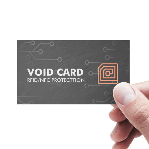 Void card with RFID/NFC protection held by a hand on a white background.