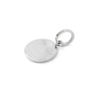 Silver keychain with circular design on a white background