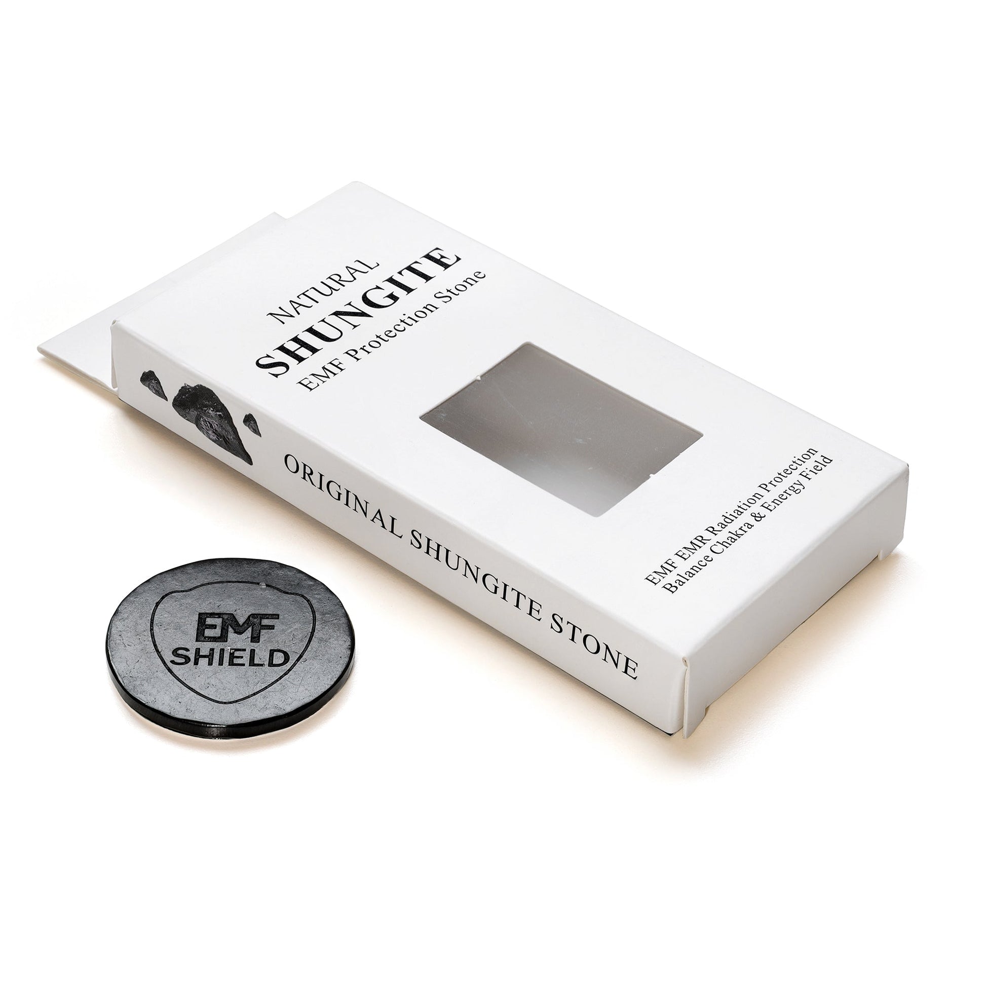 Shungite stone with packaging labeled 'EMF Shield' on a white background