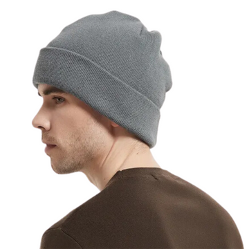 Man wearing a gray beanie on a white background